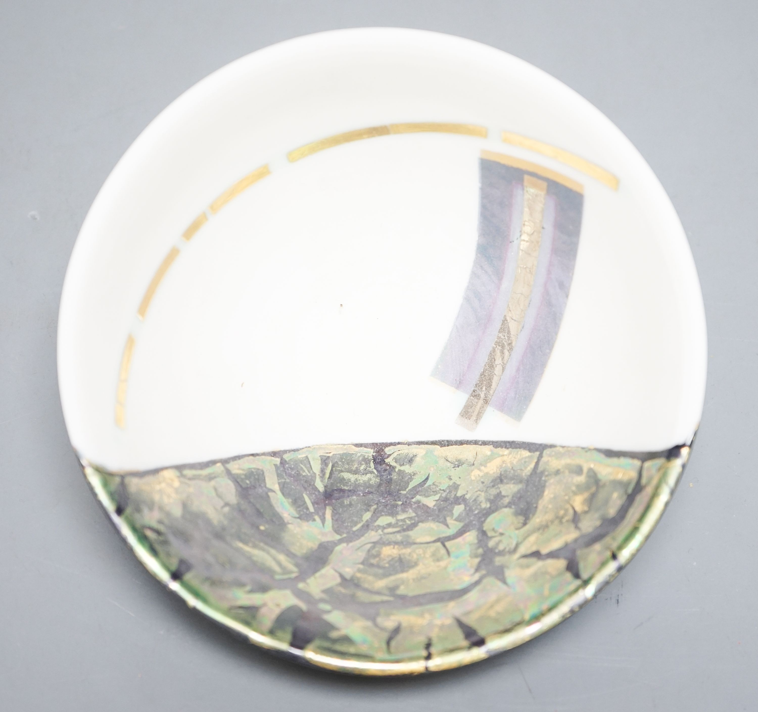 Tony Laverick (b.1961), a geometric metallic lustre decorated porcelain bowl 15cm